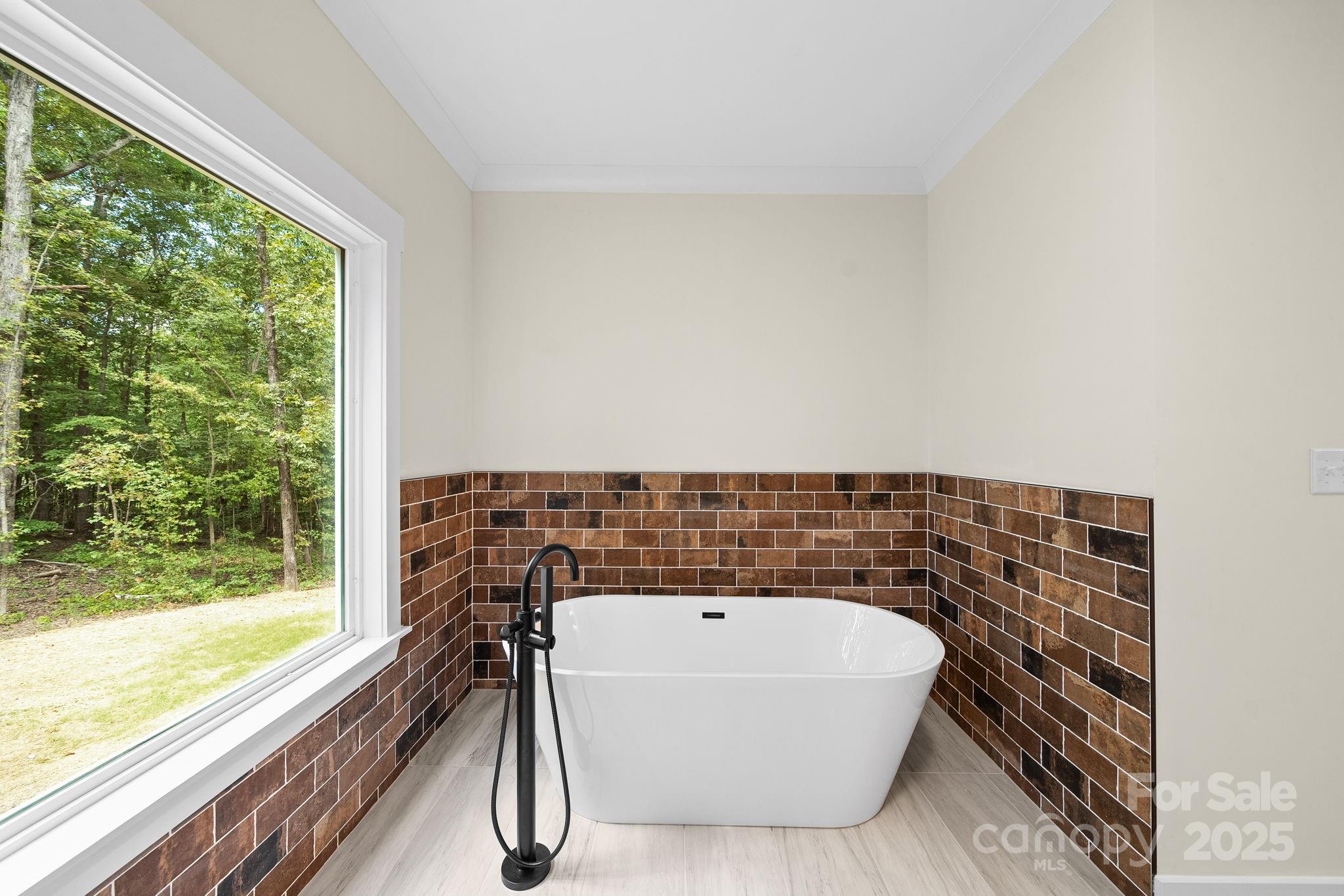 4460 R R L Lane Midland, NC 28107 - Photo 27 of 48 a bathroom with a bathtub and window