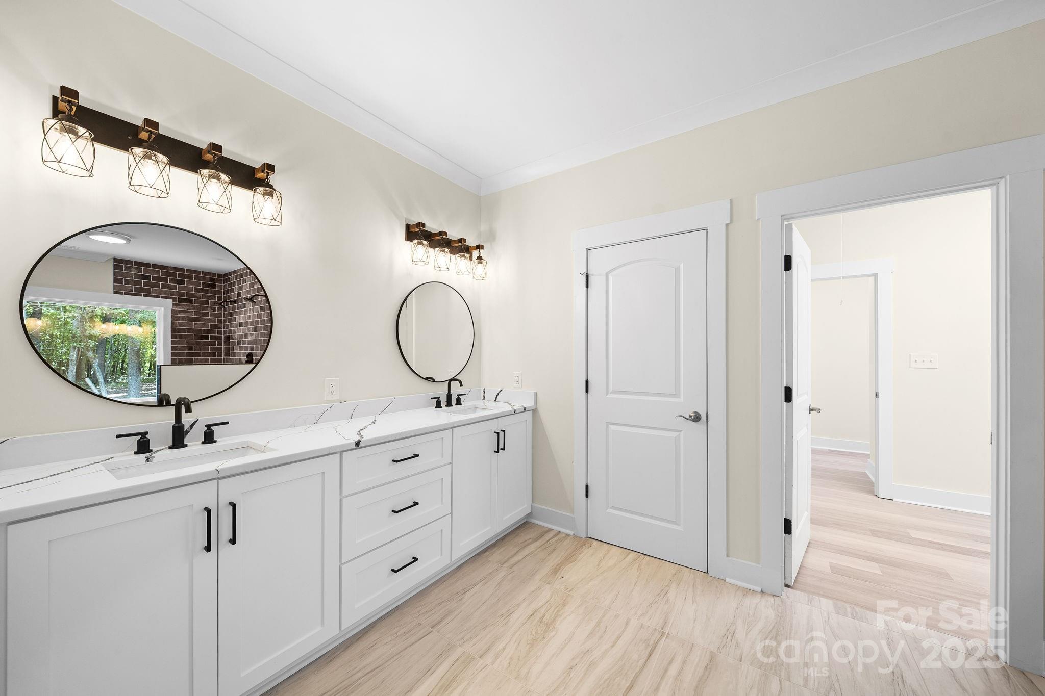 4460 R R L Lane Midland, NC 28107 - Photo 28 of 48 a bathroom with 2 sink and a mirror