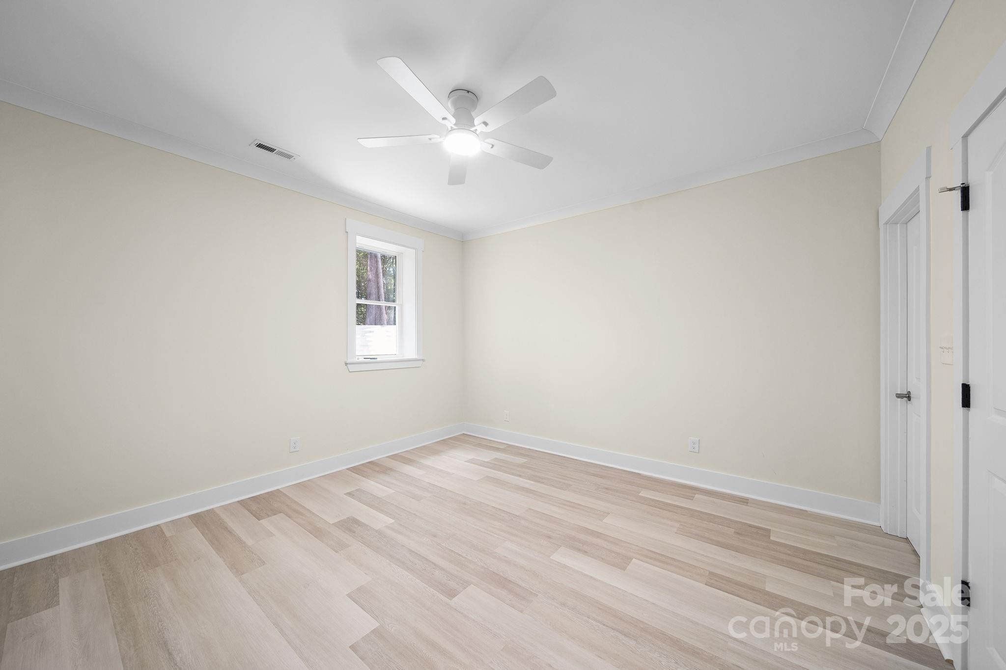 4460 R R L Lane Midland, NC 28107 - Photo 37 of 48 a view of an empty room with wooden floor and a window