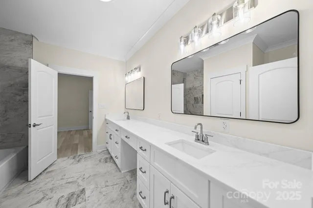 a bathroom with a double vanity sink mirror and double