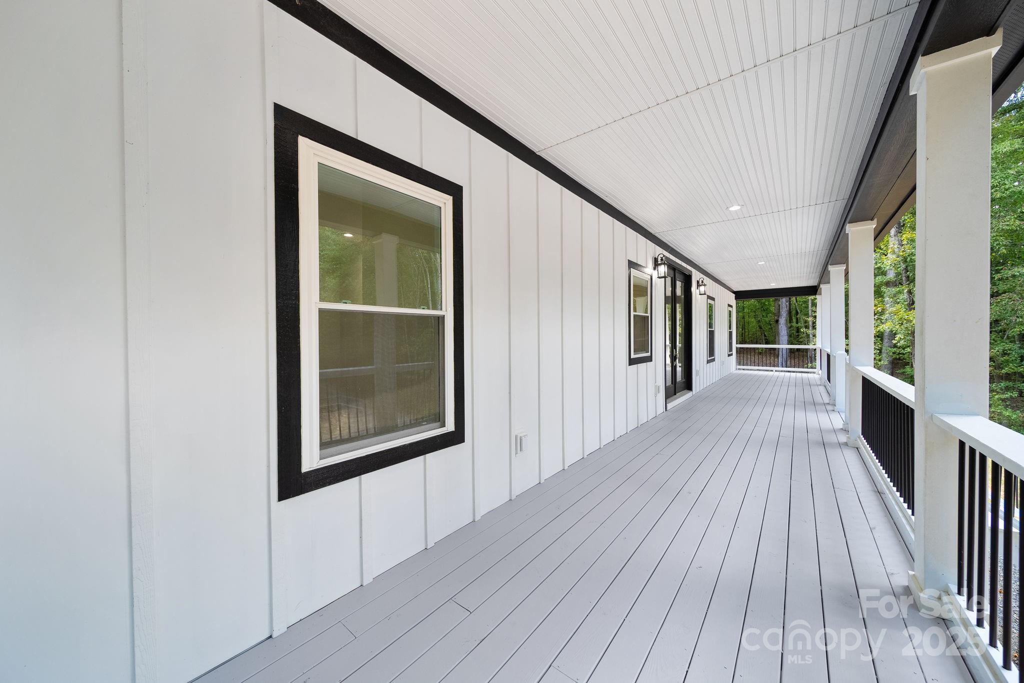 4460 R R L Lane Midland, NC 28107 - Photo 43 of 48 a view of a hallway with wooden floor and staircase
