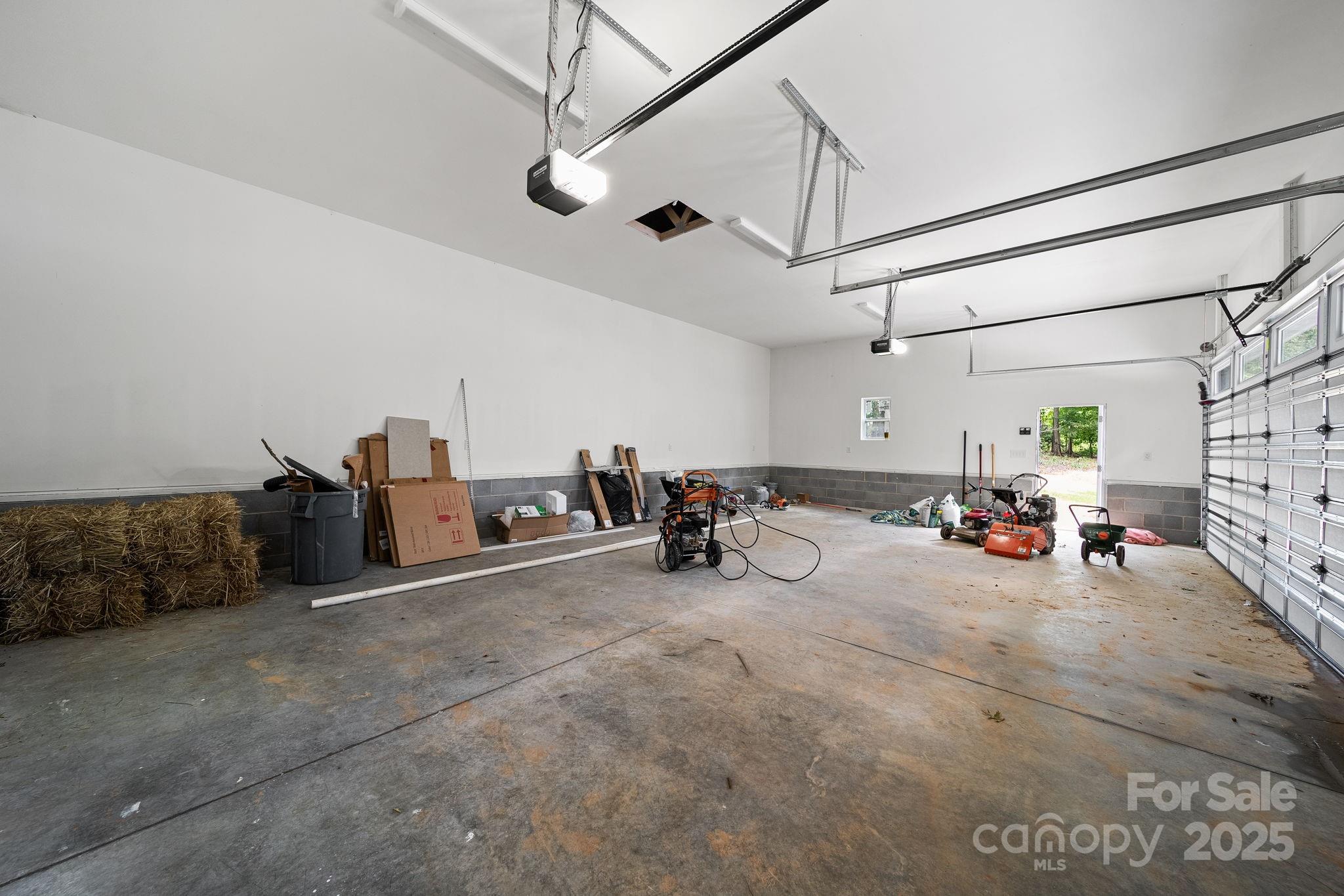 4460 R R L Lane Midland, NC 28107 - Photo 47 of 48 a view of a garage with a bike and white walls