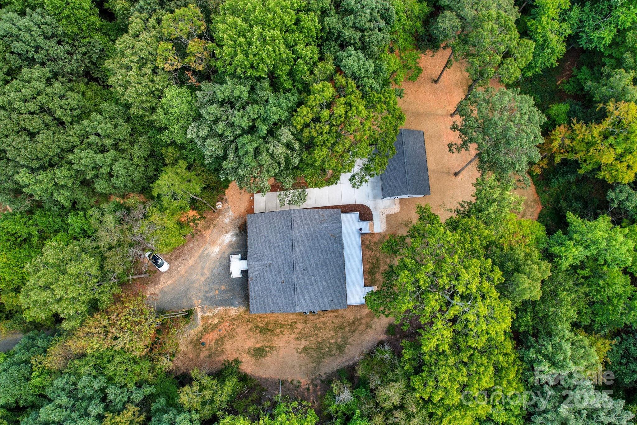 4460 R R L Lane Midland, NC 28107 - Photo 7 of 48 an aerial view of a house with a yard and trees all around