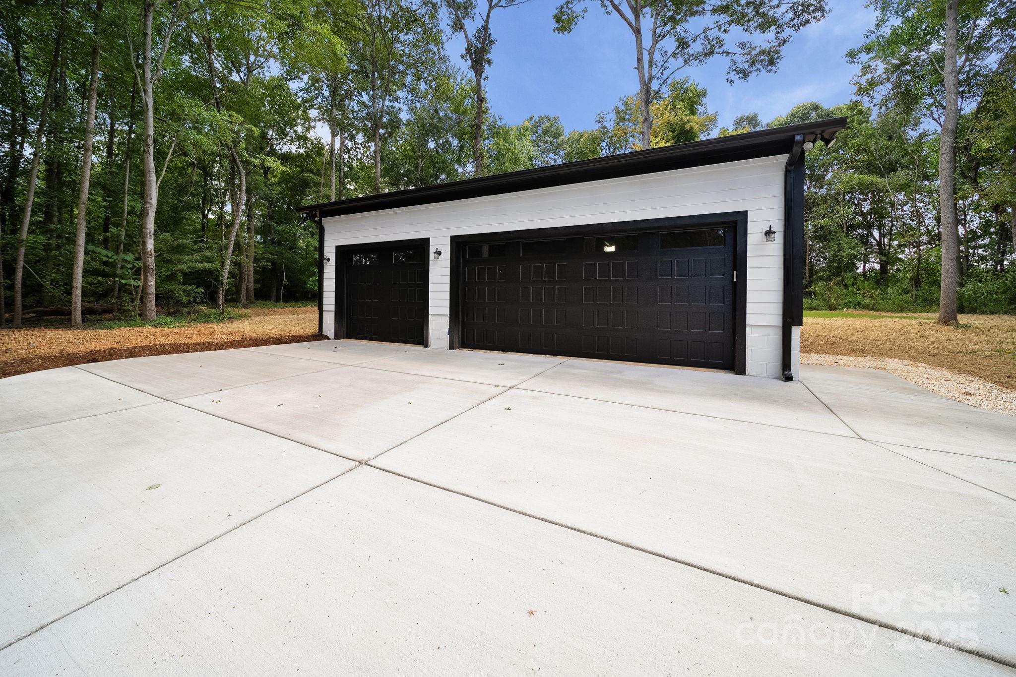 4460 R R L Lane Midland, NC 28107 - Photo 8 of 48 a front view of a house with a yard and garage