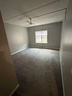 an empty room with windows and entrance