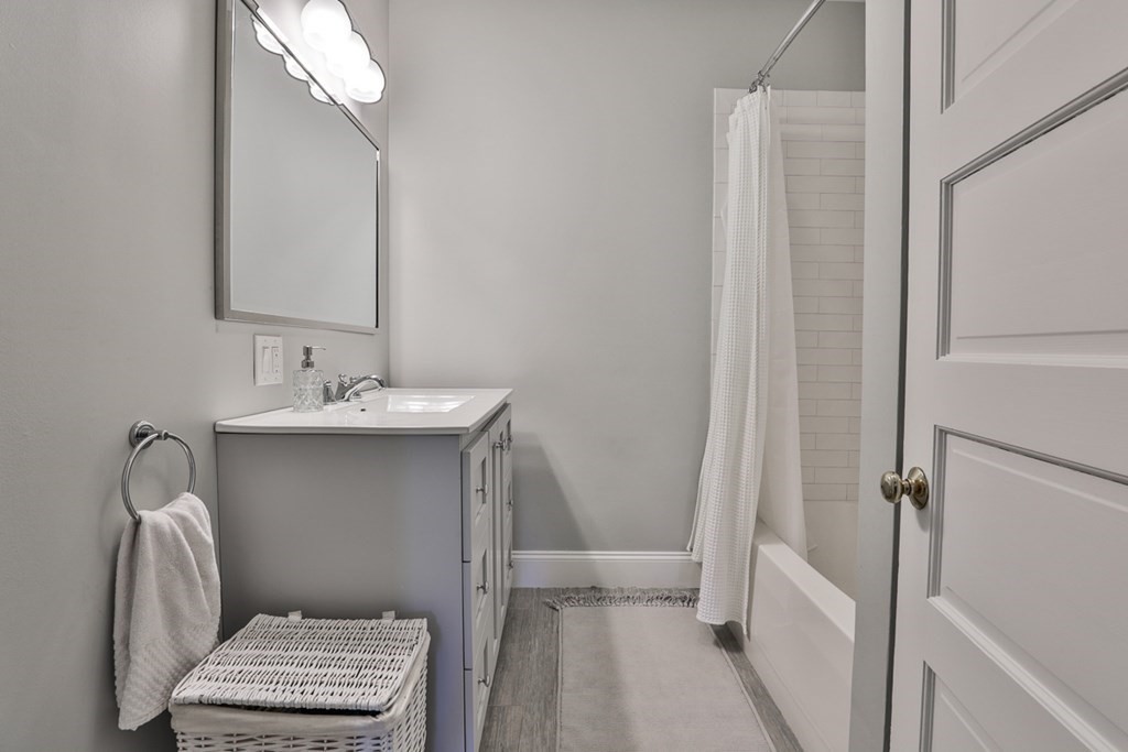 27 Walnut Road Hamilton, MA 01982 - Photo 26 of 42 a bathroom with a sink toilet and a mirror