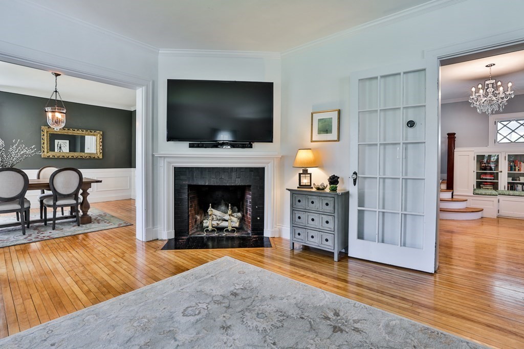 27 Walnut Road Hamilton, MA 01982 - Photo 7 of 42 a living room with furniture and a flat screen tv