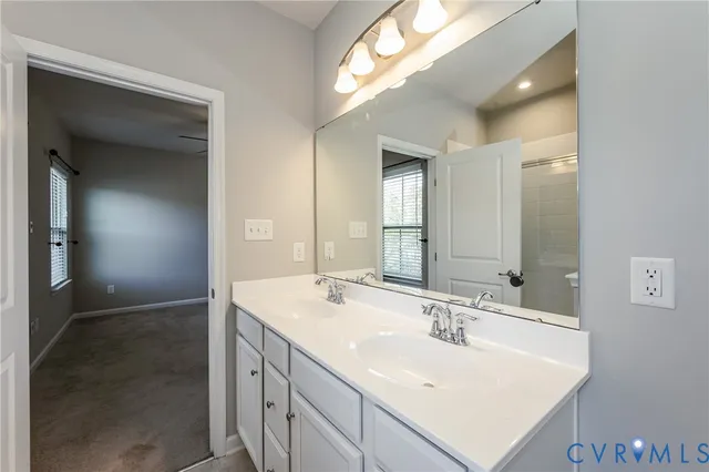 a white bath tub sitting next to a window
