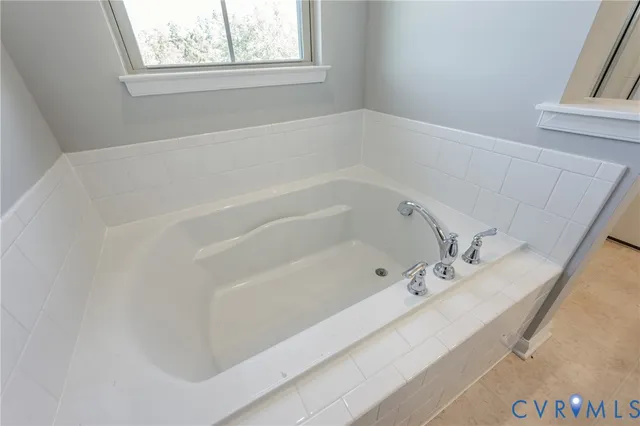 a bathroom with a sink and a large mirror