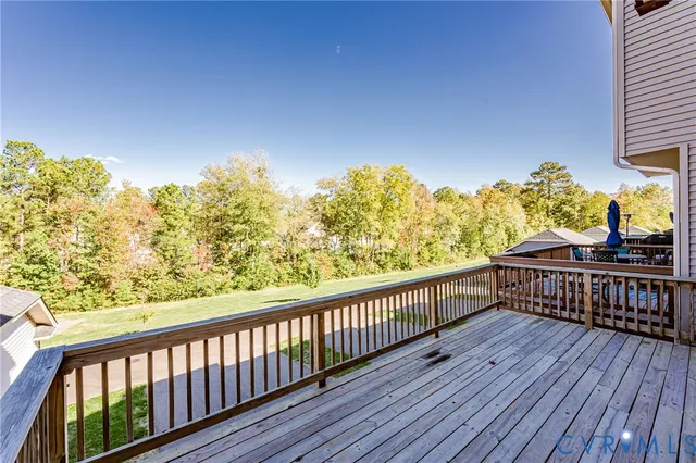 a view of a balcony with wooden floor