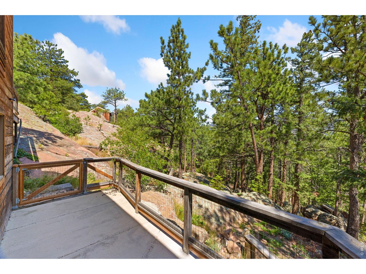 128 Elk Road Lyons, CO 80540 - Photo 34 of 50 Back patio off of the basement level