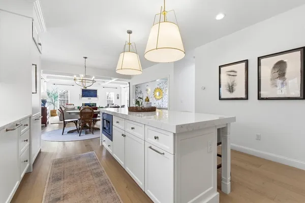 a large kitchen with lots of counter space and furniture