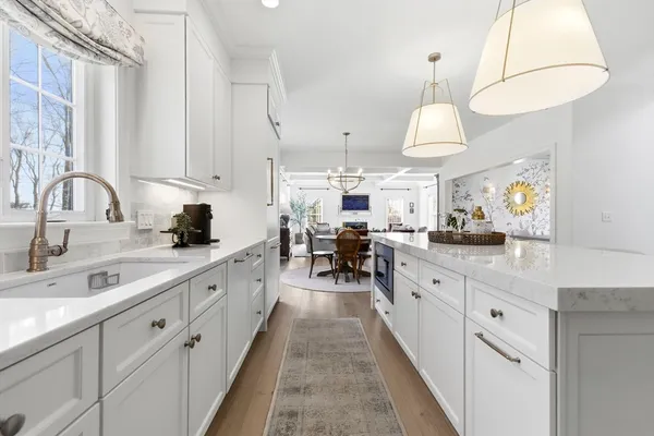 a large kitchen with lots of counter space and a sink