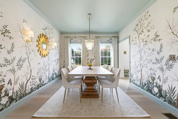 a dining room with furniture and window