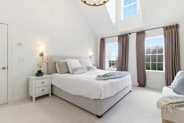 a bed room with a bed and a window