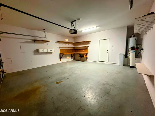 a view of empty room with ceiling fan