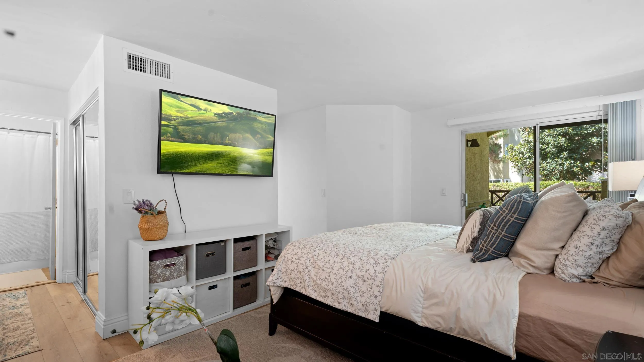 725 Brookstone Road, Unit 101 Chula Vista, CA 91913 - Photo 14 of 31 a bedroom with a bed and a flat screen tv