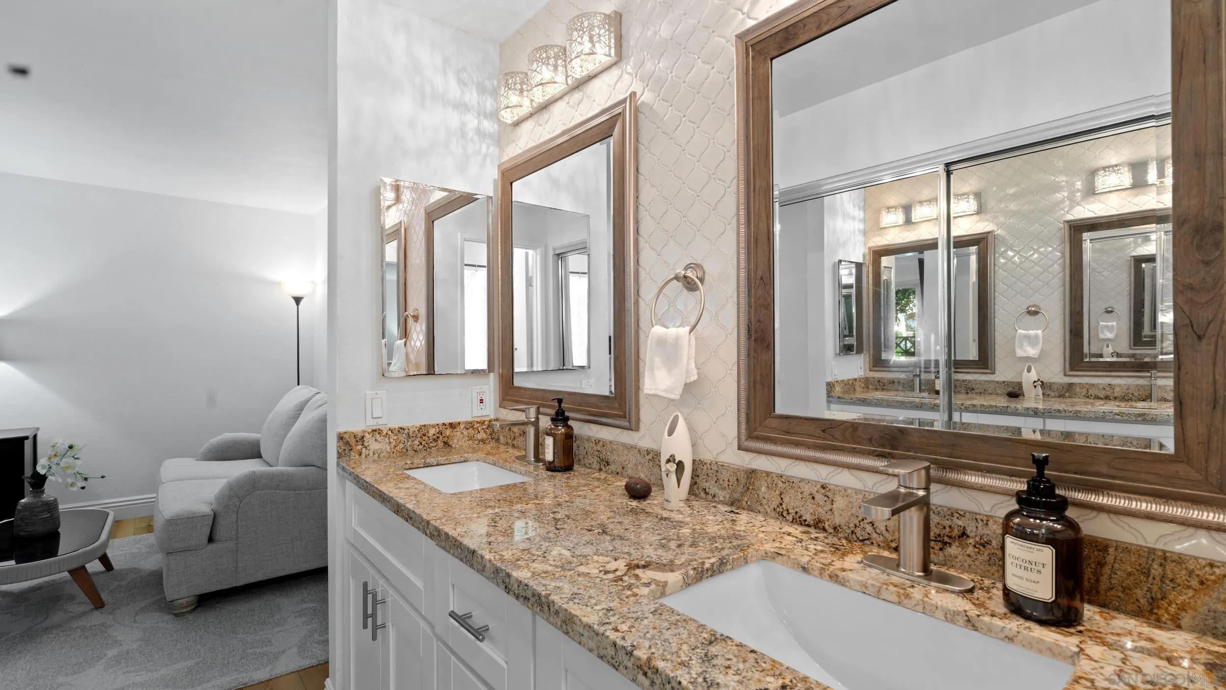 725 Brookstone Road, Unit 101 Chula Vista, CA 91913 - Photo 18 of 31 a bathroom with double vanity sinks and a mirror