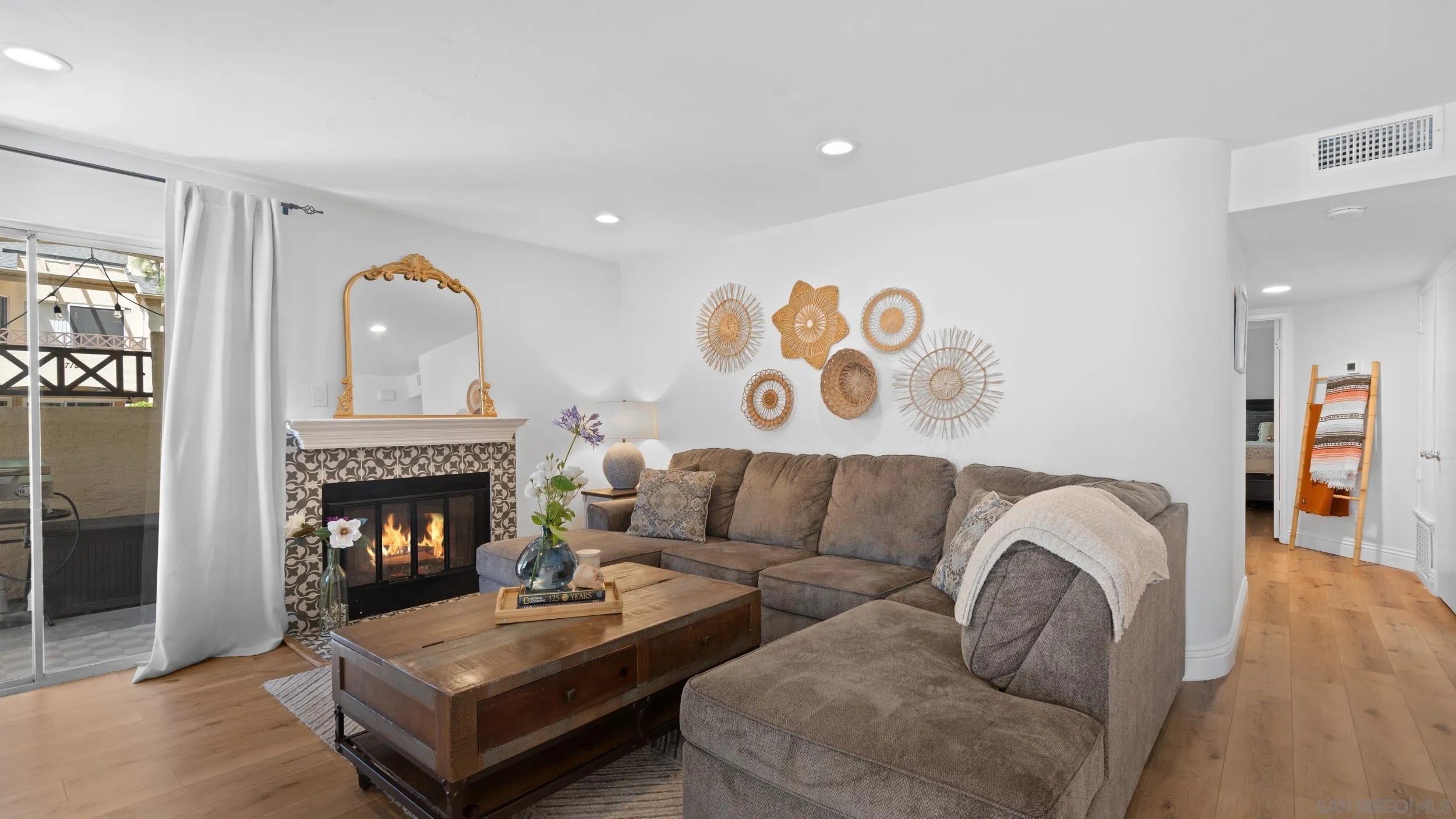 725 Brookstone Road, Unit 101 Chula Vista, CA 91913 - Photo 4 of 31 a living room with furniture and a fireplace
