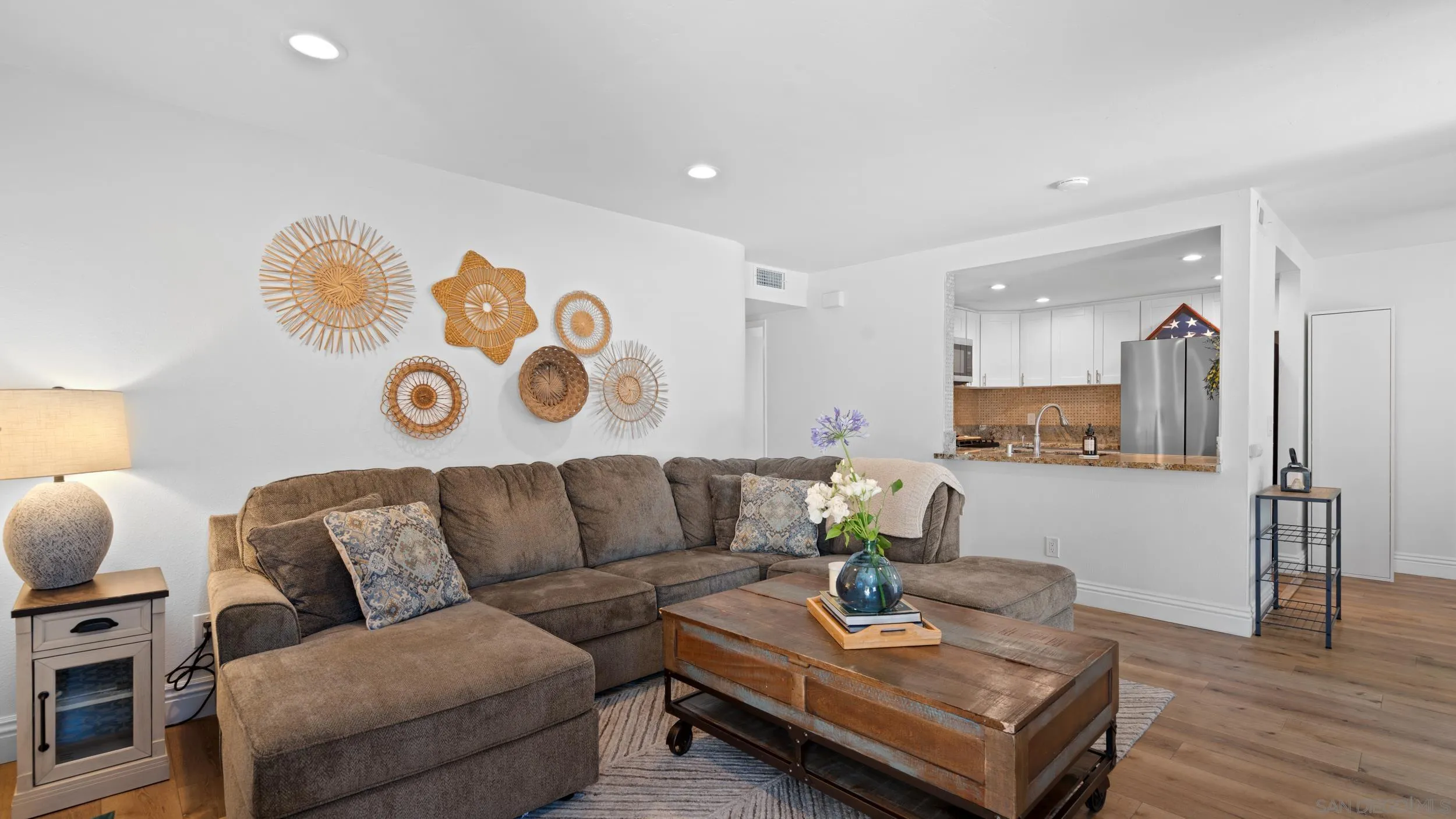 725 Brookstone Road, Unit 101 Chula Vista, CA 91913 - Photo 6 of 31 a living room with furniture and wooden floor