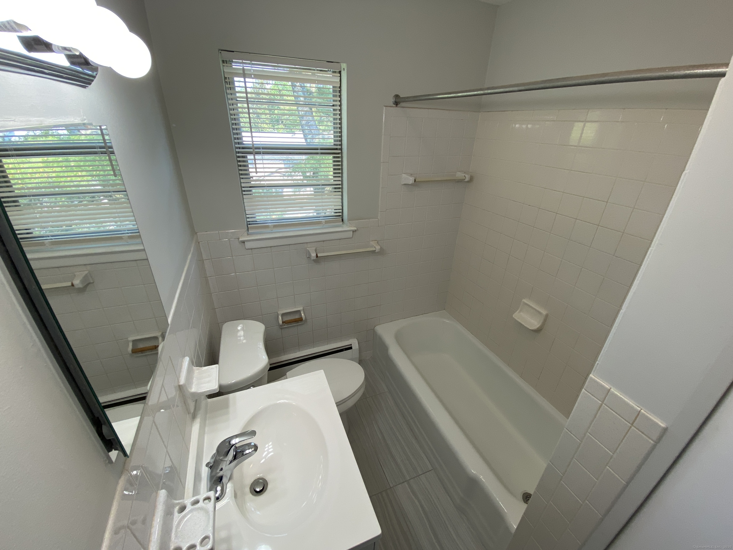 15 Elizabeth Street, Unit 31 West Haven, CT 06516 - Photo 9 of 9 a bathroom with a sink and a tub