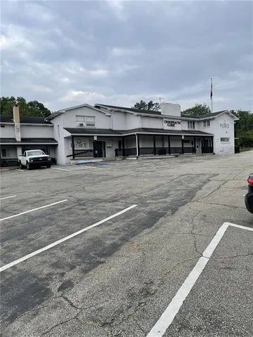 a view of a car park in front of house
