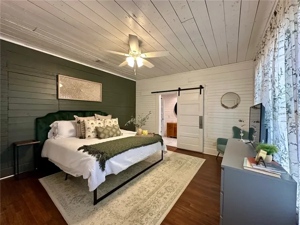 a view of a dining room with furniture and wooden floor