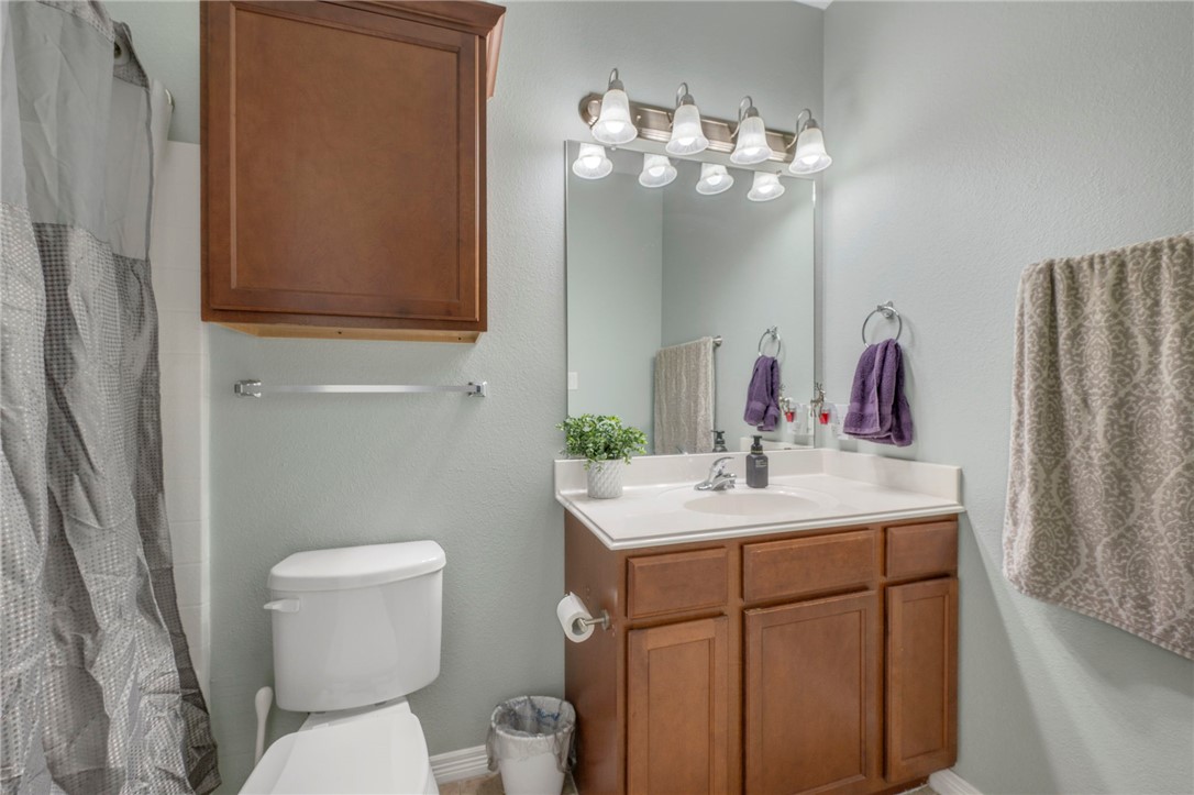 1198 Jones-Butler Road, Unit 2109 College Station, TX 77840 - Photo 9 of 16 a bathroom with a toilet sink and mirror