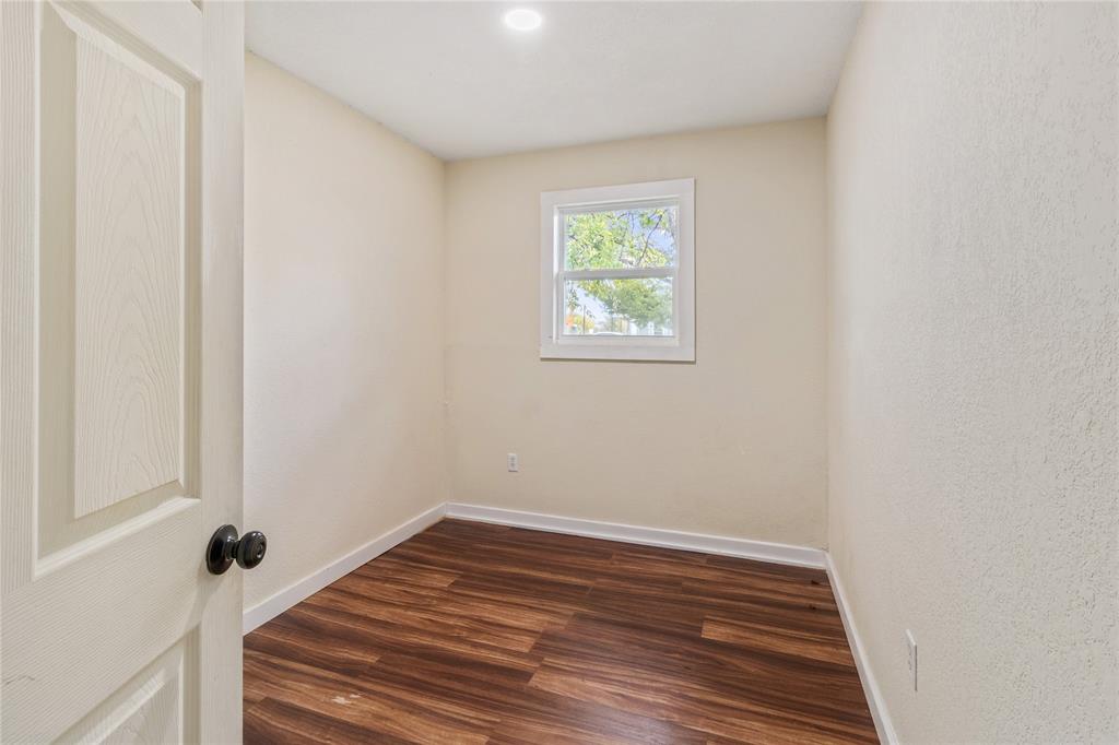 212 East 2nd Street Coleman, TX 76834 - Photo 10 of 17 a view of a room with wooden floor and window