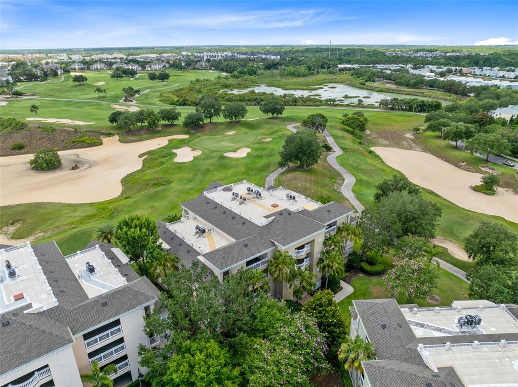 1360 Centre Ct Ridge Drive, Unit 201 Reunion, FL 34747 - Photo 2 of 29 an aerial view of a residential houses with outdoor space and city view