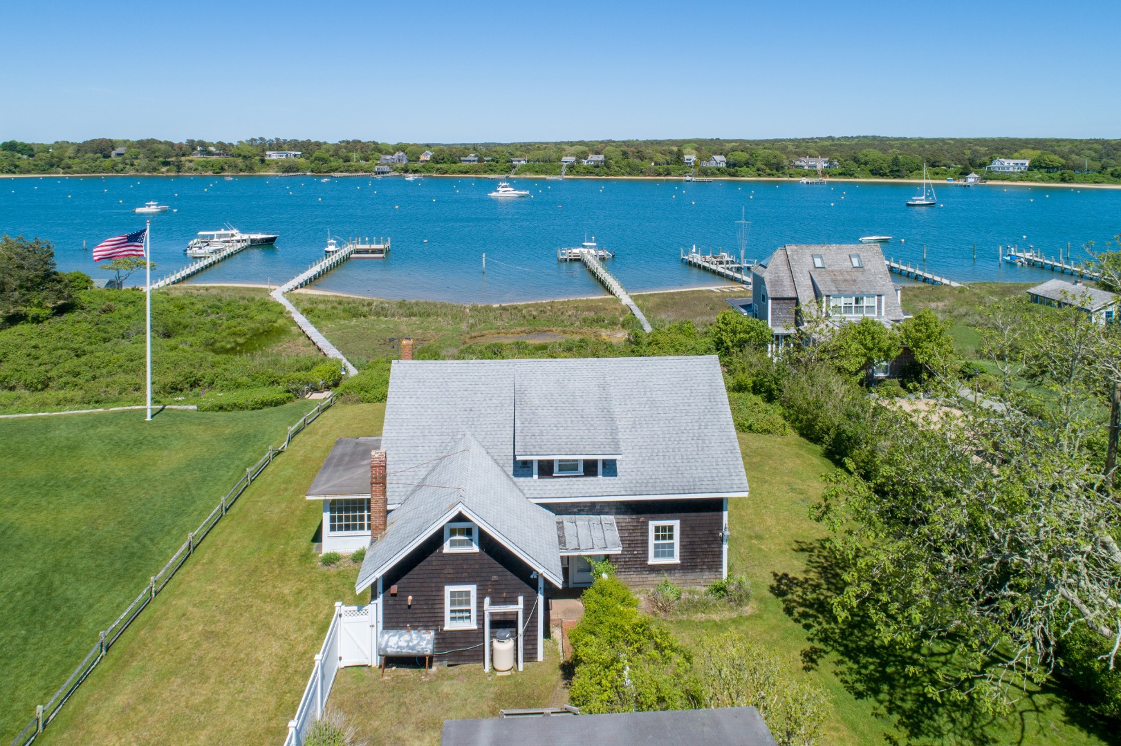 44 Green Hollow Road Edgartown, MA 02539 - Photo 2 of 5 an aerial view of a house with a garden and lake view