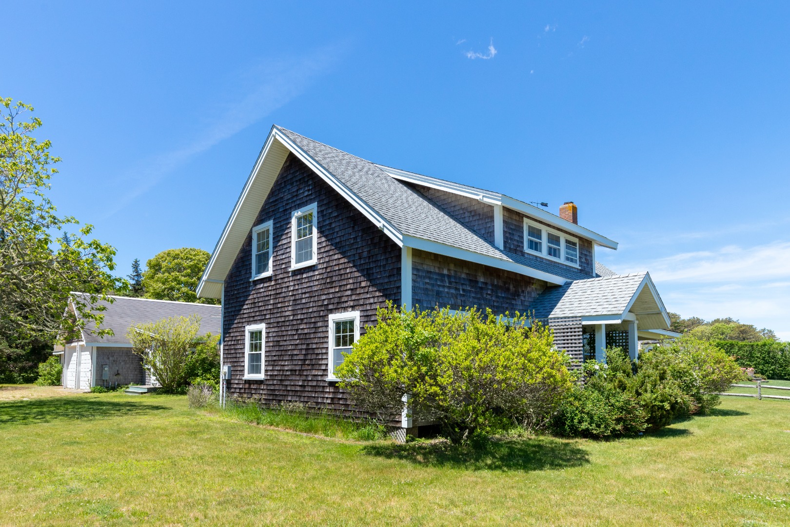 44 Green Hollow Road Edgartown, MA 02539 - Photo 3 of 5 a front view of a house with a yard