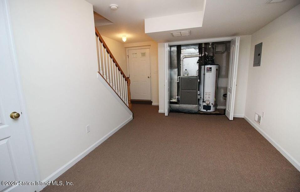 65 Gwenn Loop Staten Island, NY 10314 - Photo 12 of 18 a view of a room with staircase