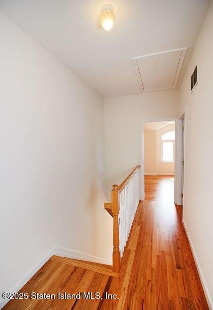 65 Gwenn Loop Staten Island, NY 10314 - Photo 7 of 18 a view of a hallway with wooden floor