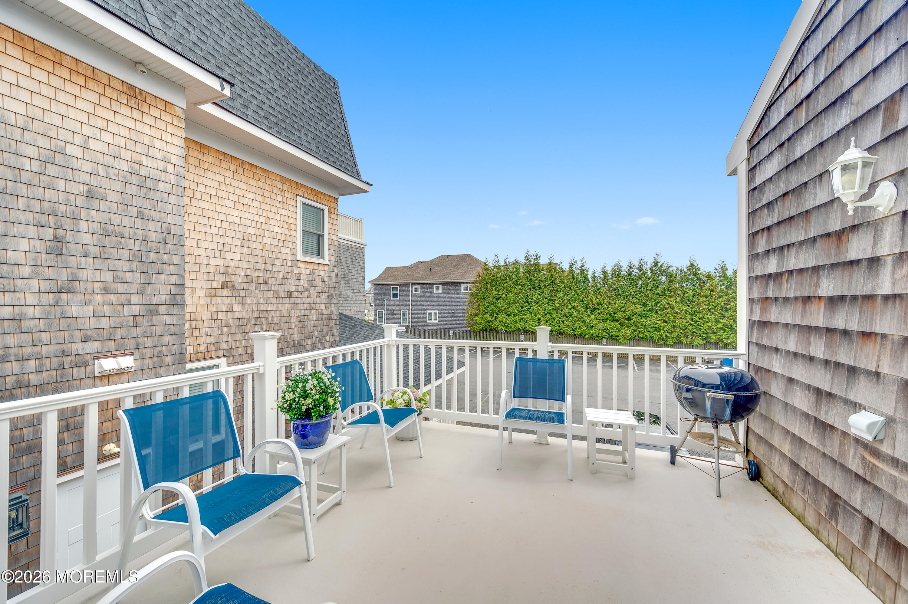 41 A Mount Street Bay Head, NJ 08742 - Photo 16 of 33 a view of a patio with a table and chairs and potted plants