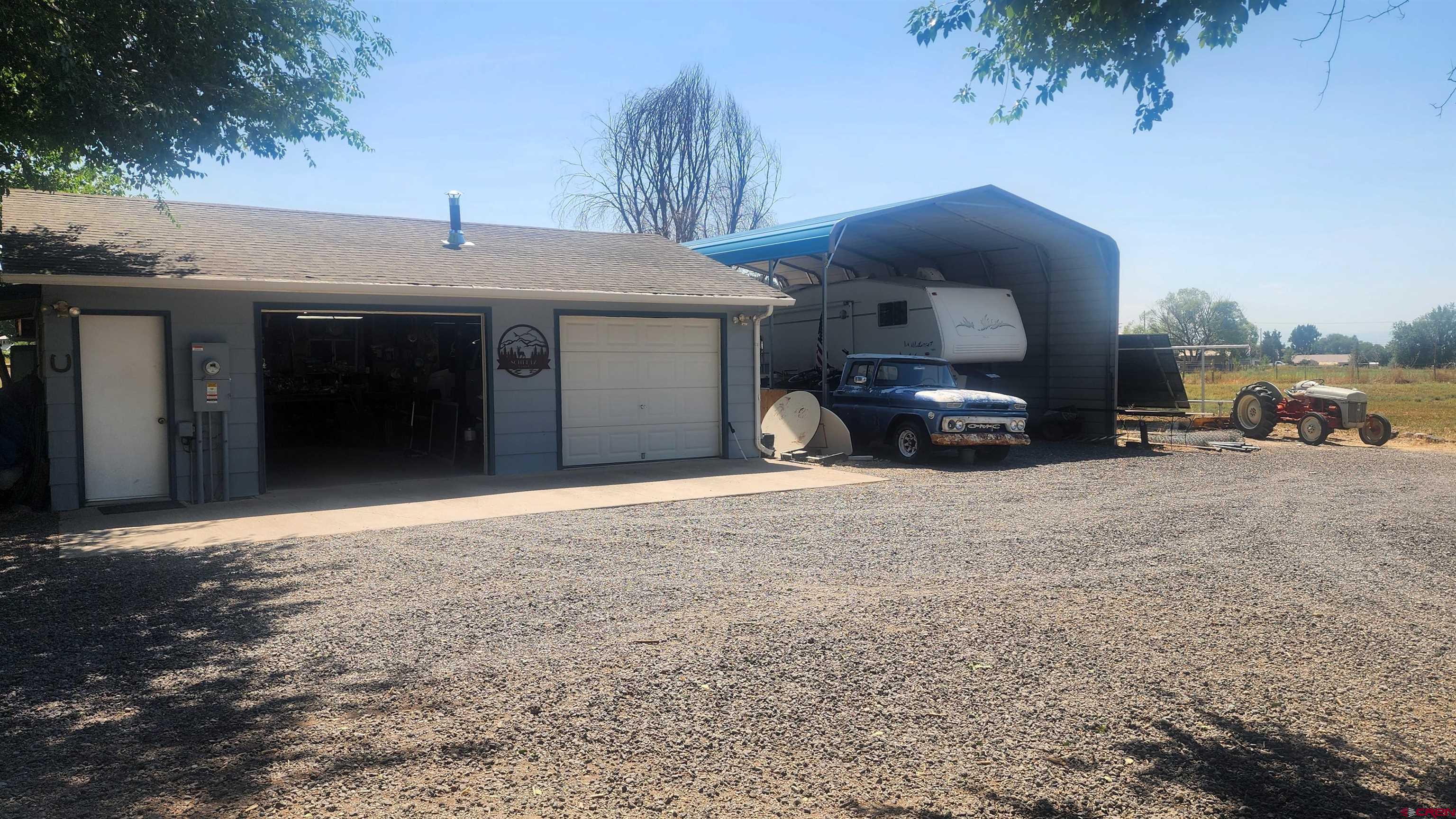 12142 2135th Road Austin, CO 81410 - Photo 34 of 45 a view of a car in front of a building