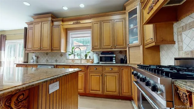a bathroom with a tub a sink and a mirror