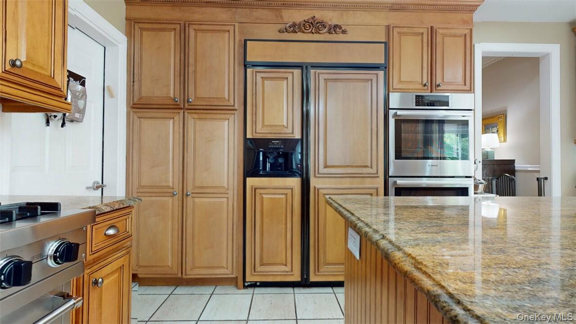 9 Roselawn Road Highland Mills, NY 10930 - Photo 17 of 46 Kitchen with light tile patterned floors, stainless steel appliances, and light stone countertops