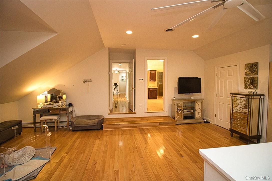 9 Roselawn Road Highland Mills, NY 10930 - Photo 23 of 46 Living room featuring ceiling fan, wood-type flooring, and lofted ceiling