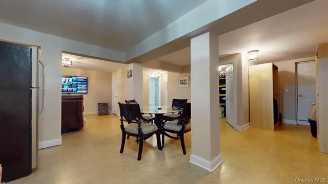 a kitchen with stainless steel appliances granite countertop a sink refrigerator and cabinets