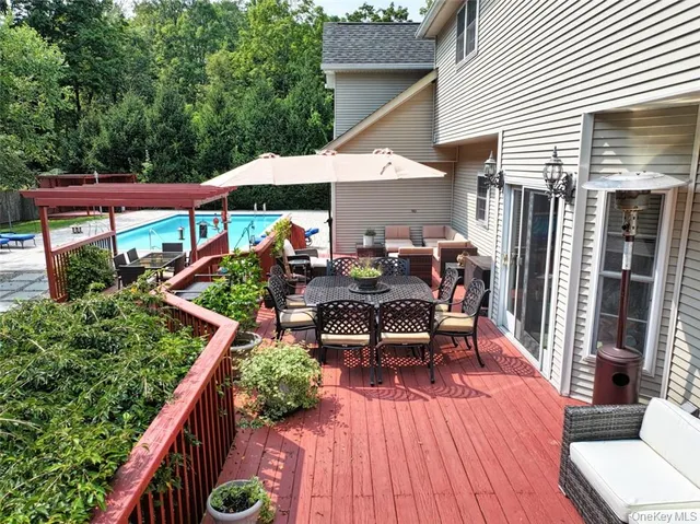 a view of a wooden deck with a bench