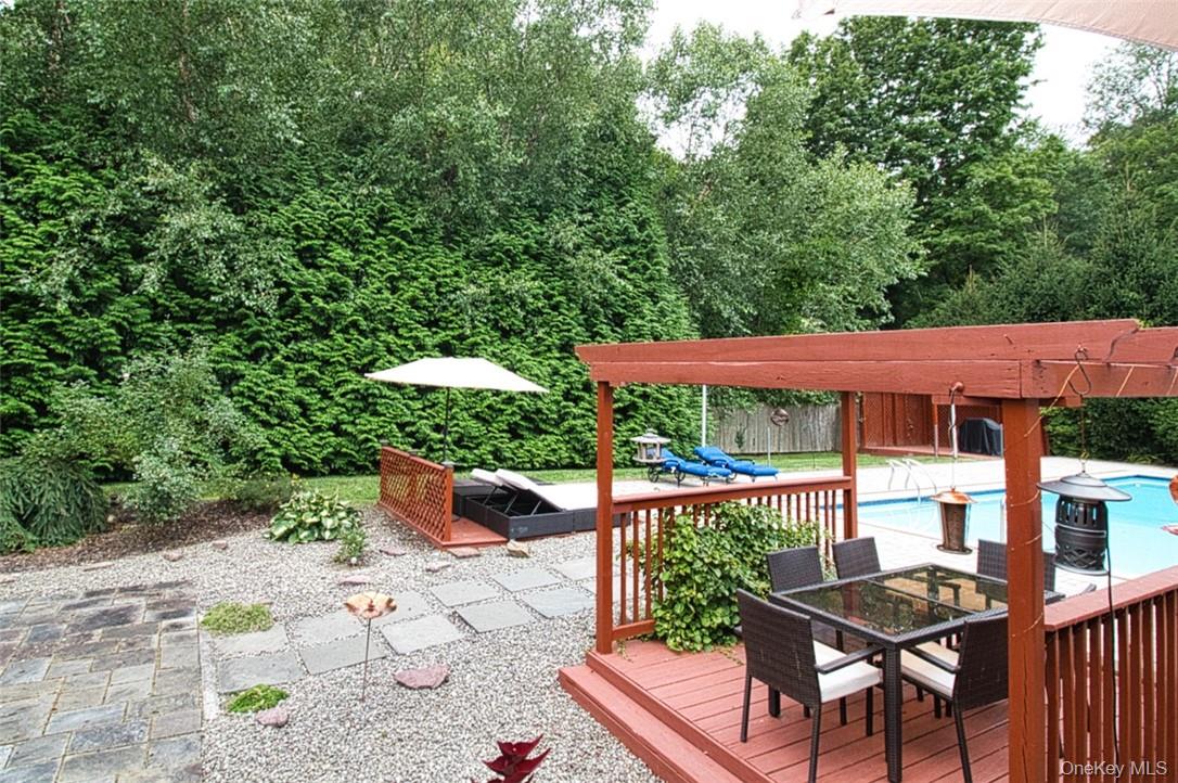 9 Roselawn Road Highland Mills, NY 10930 - Photo 34 of 46 Backyard w/ two pergolas, flagstone patio, wooden sun deck for lounge chairs
