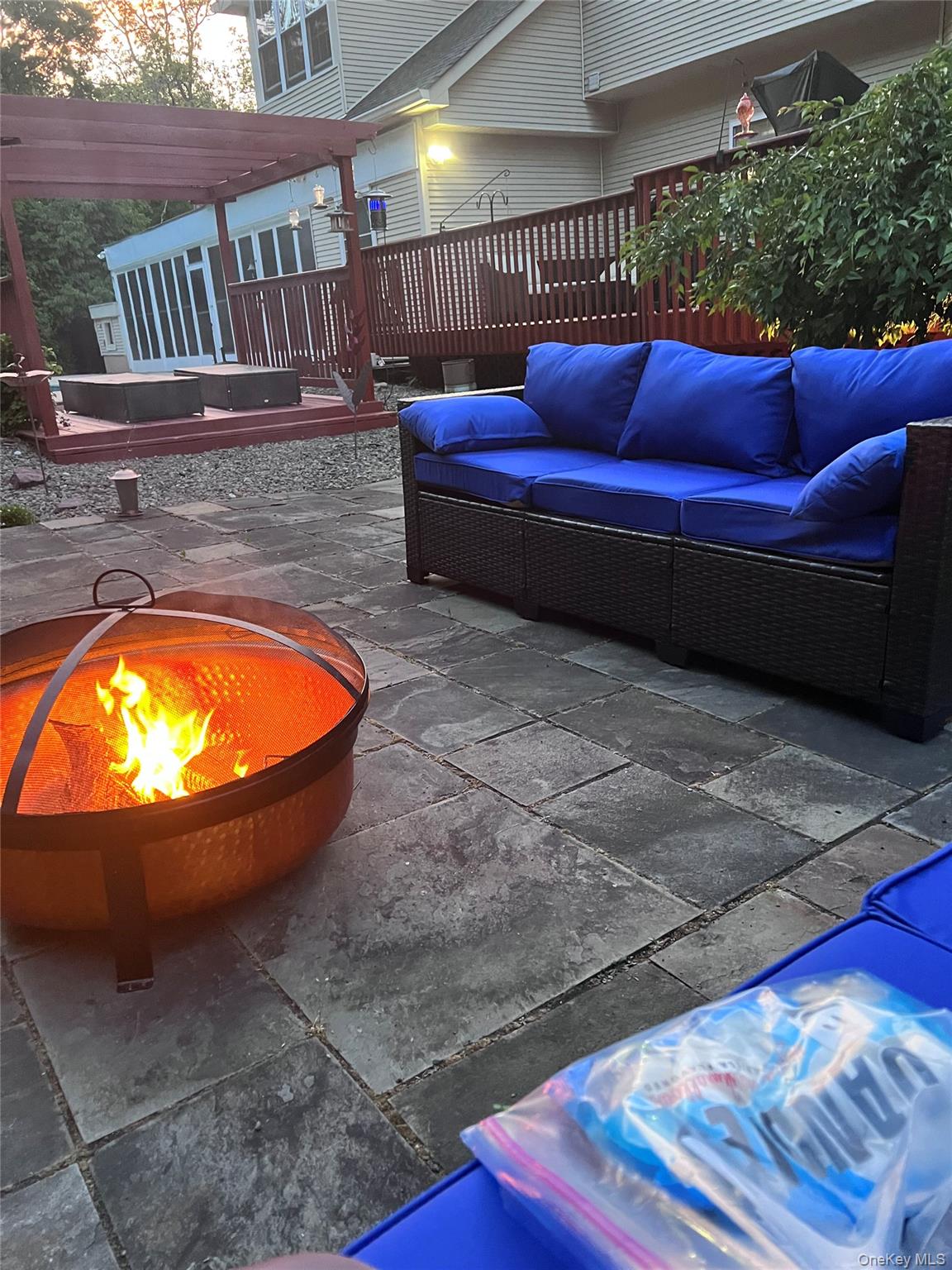 9 Roselawn Road Highland Mills, NY 10930 - Photo 38 of 46 View of flagstone patio featuring an outdoor living space with a fire pit and a deck