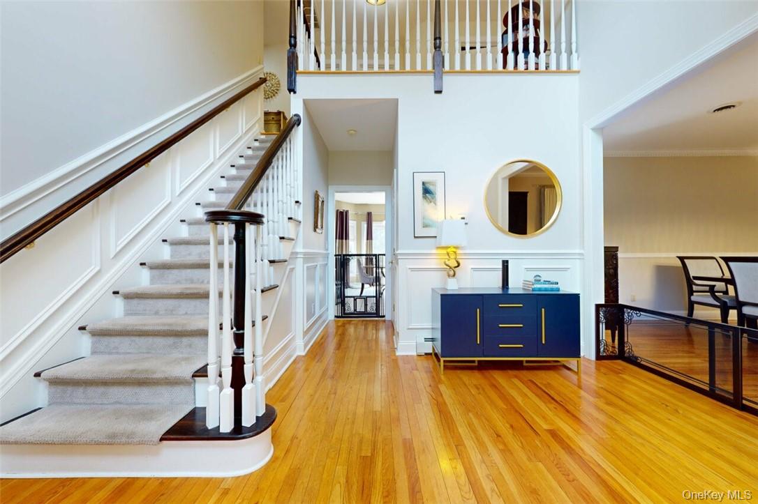 9 Roselawn Road Highland Mills, NY 10930 - Photo 5 of 46 Dramatic foyer, with vauled ceiling,large chandelier, inlaid wood floors, custom mouldings on walls , upgraded staircase , beautiful Palladium window for lots of light
