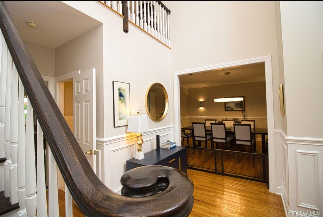 9 Roselawn Road Highland Mills, NY 10930 - Photo 6 of 46 Front entry. Dramatic vaulted ceiling,Palladium window, hardwood floors with medallion inlay, beautiful upgraded banisters, custom new picture frame mouldings, stunning fixture.