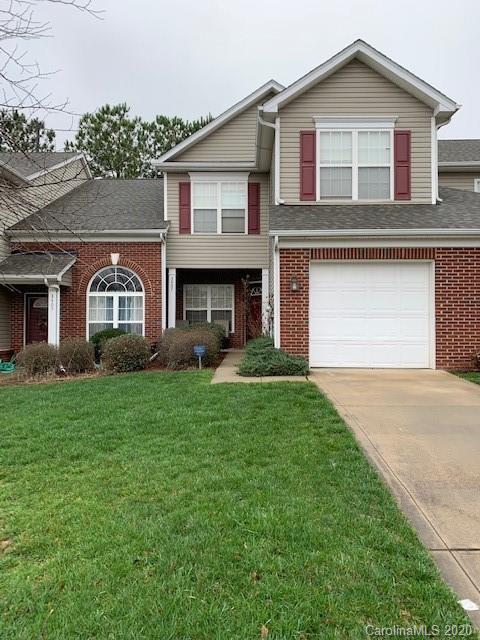 3407 Summerfield Ridge Lane Matthews, NC 28105 - Photo 1 of 11 a front view of a house with a yard and garage
