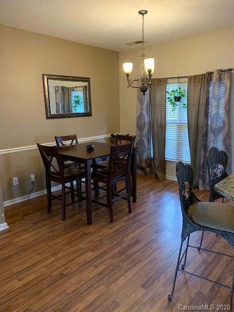 3407 Summerfield Ridge Lane Matthews, NC 28105 - Photo 6 of 11 a view of a dining room with furniture and wooden floor