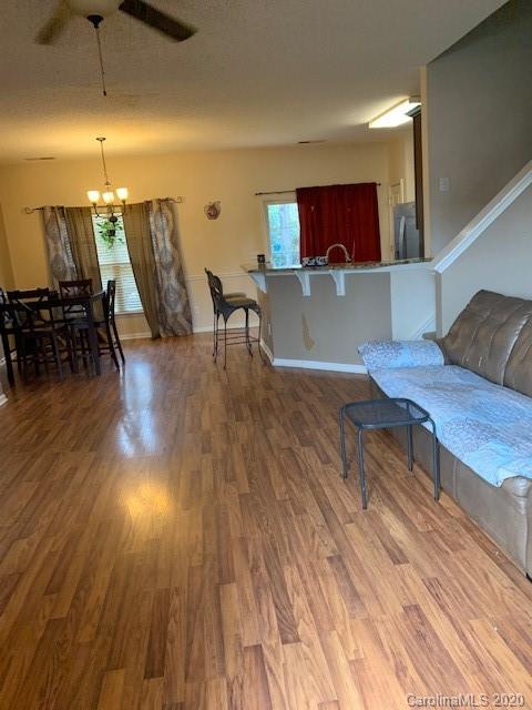 3407 Summerfield Ridge Lane Matthews, NC 28105 - Photo 7 of 11 a living room with furniture and a wooden floor