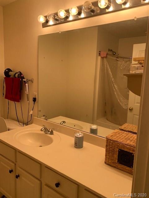 3407 Summerfield Ridge Lane Matthews, NC 28105 - Photo 10 of 11 a bathroom with a sink and a mirror