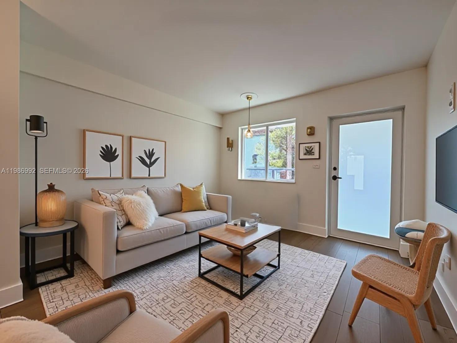 1904 Southwest 17th Avenue, Unit 3 Miami, FL 33145 - Photo 1 of 15 a living room with furniture and a flat screen tv